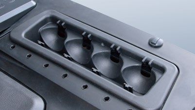 A close up of a black device with four holes in it.