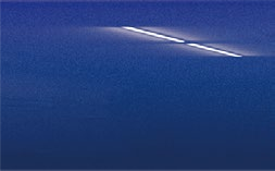 A close up of a blue surface with a white line on it.
