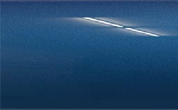A close up of a blue car door with a white line on it.