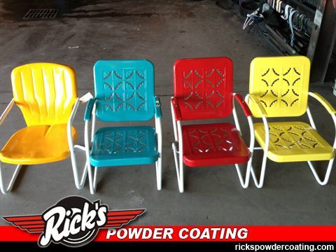 Four powder-coated metal chairs in yellow, teal, red, and yellow on a dark floor with a Rick’s Powder Coating logo.