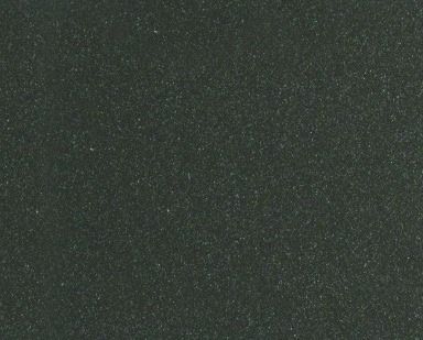 Dark, grainy green-black textured surface with scattered speckles