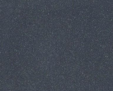 Dark gray speckled textured surface with fine scattered dots.