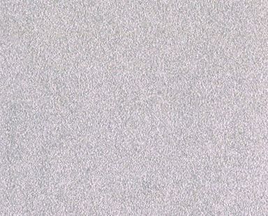 Close-up of a light gray, grainy textured surface.
