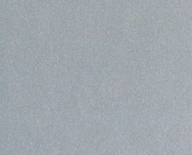 Close-up of a light gray textured surface with a subtle gradient.
