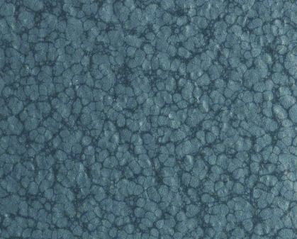 Blue-gray textured surface with a repeating stone-like pattern