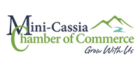 Logo for Mini-Cassia Chamber of Commerce with a stylized green mountain icon and the slogan 