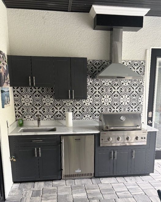 A kitchen with stainless steel appliances and wooden cabinets