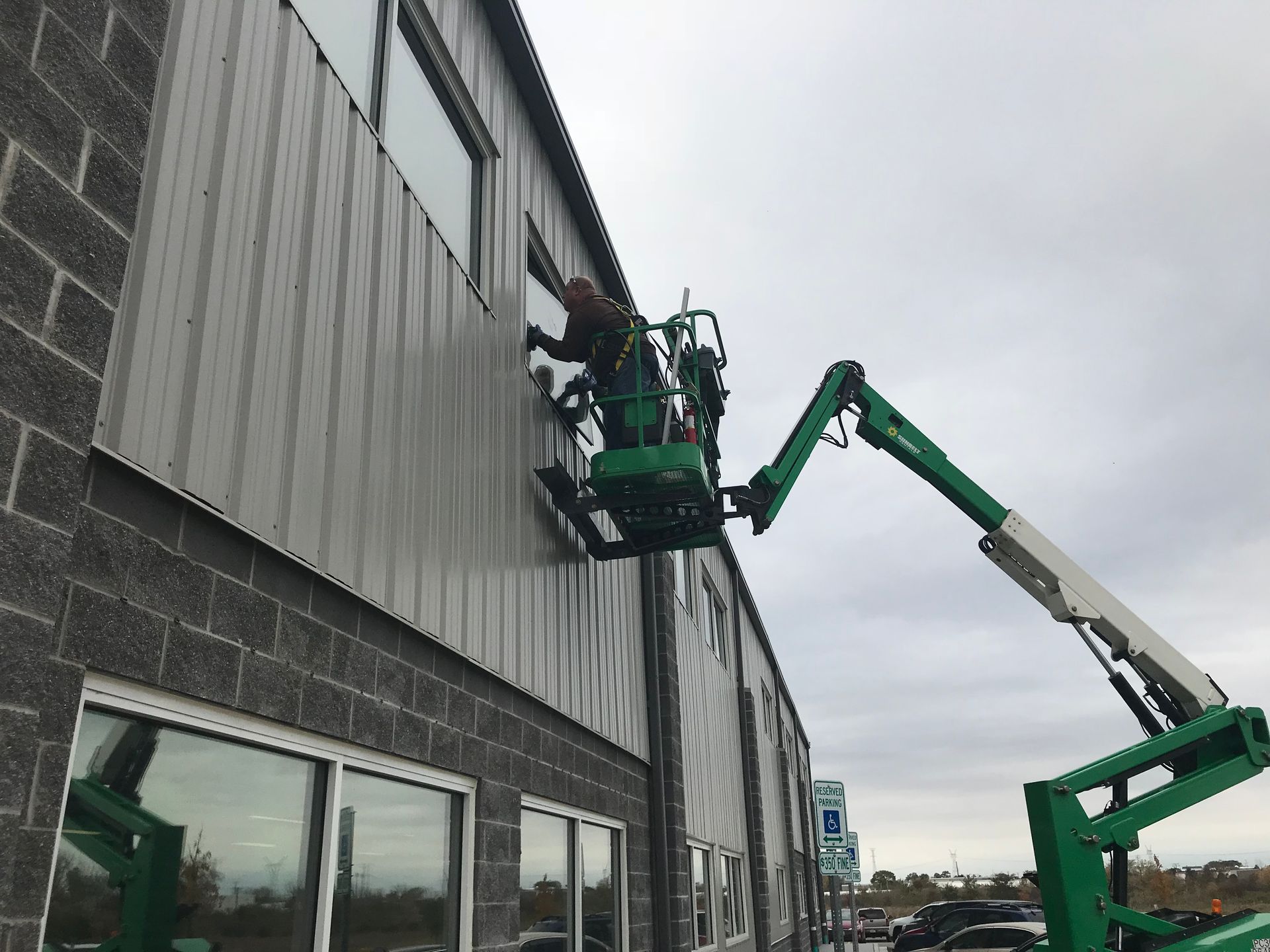 man working on glass window