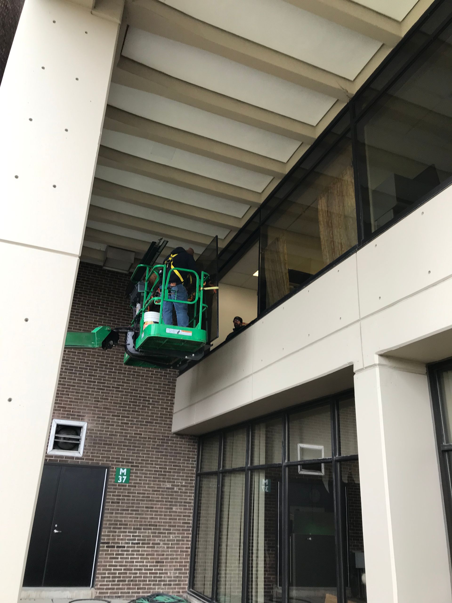 working on second level glass window