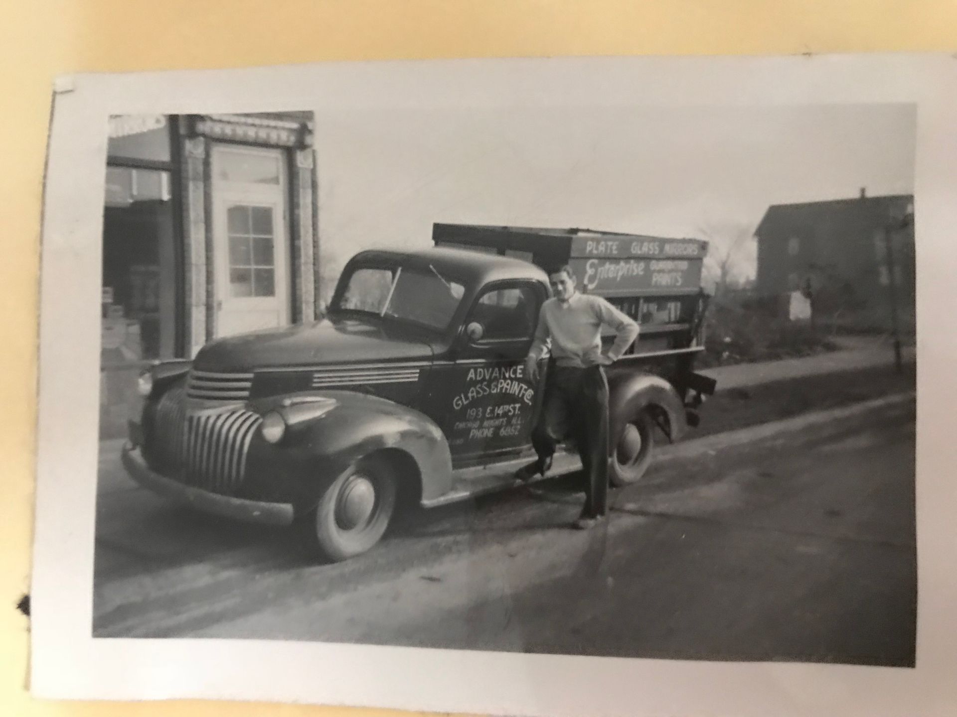 old photo of car and owner