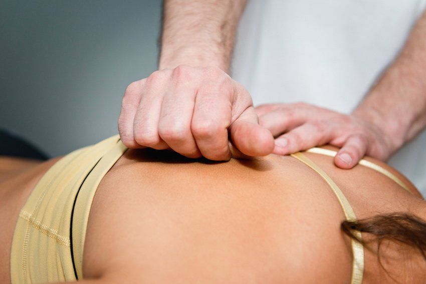 practitioner working on patient's back