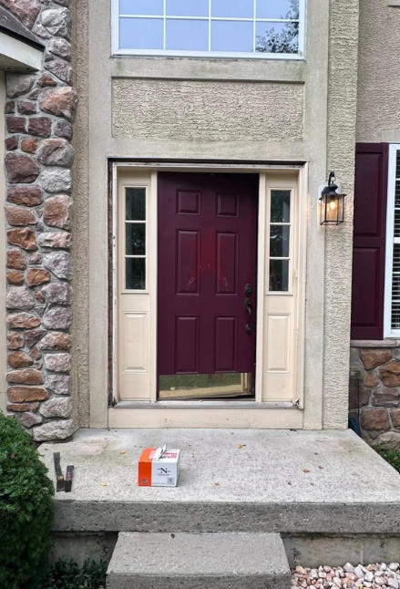 The front door of a house with an old door.