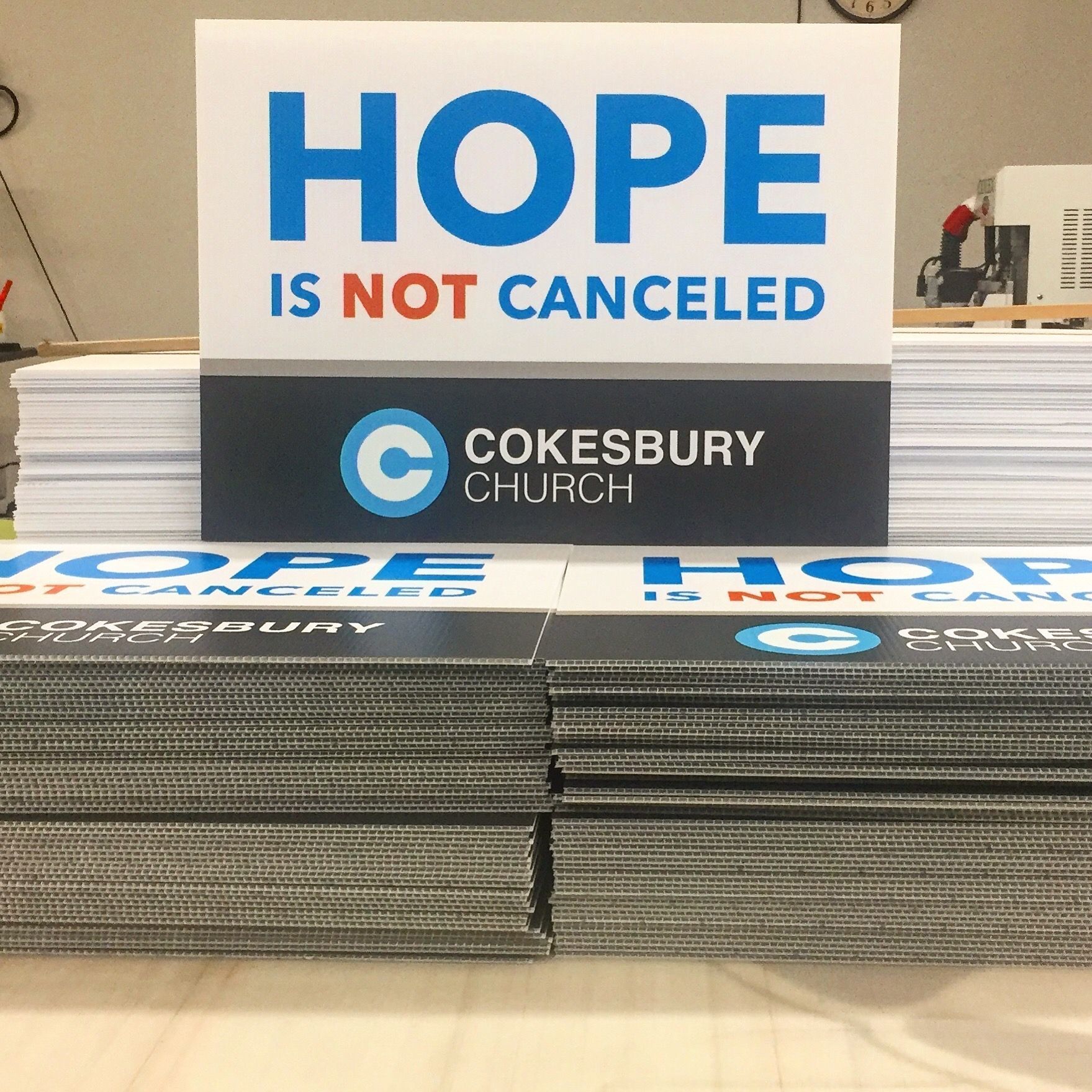 Stacks of signs for Cokesbury Church; signs say