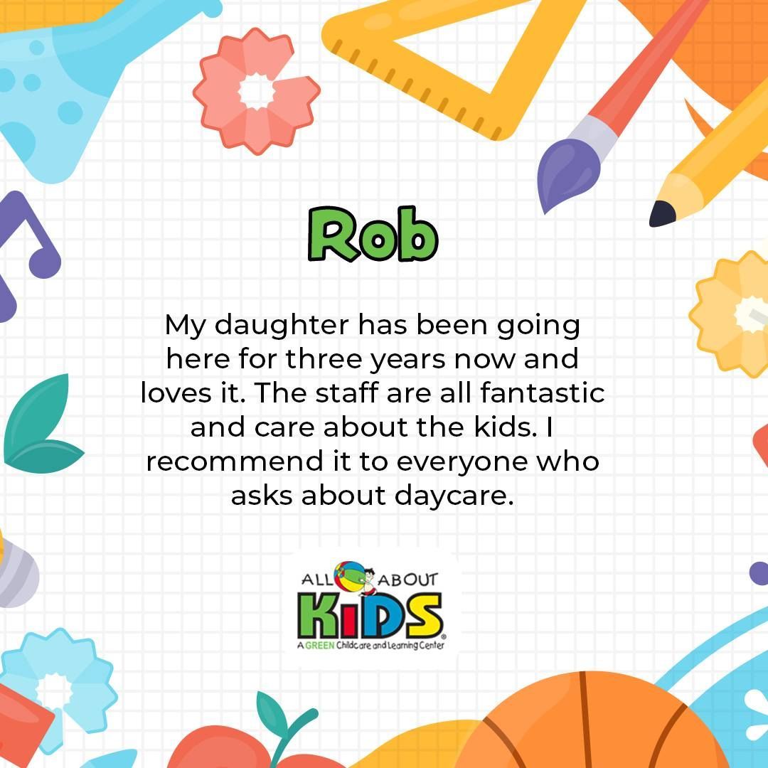 A woman is sitting on the floor with a group of babies