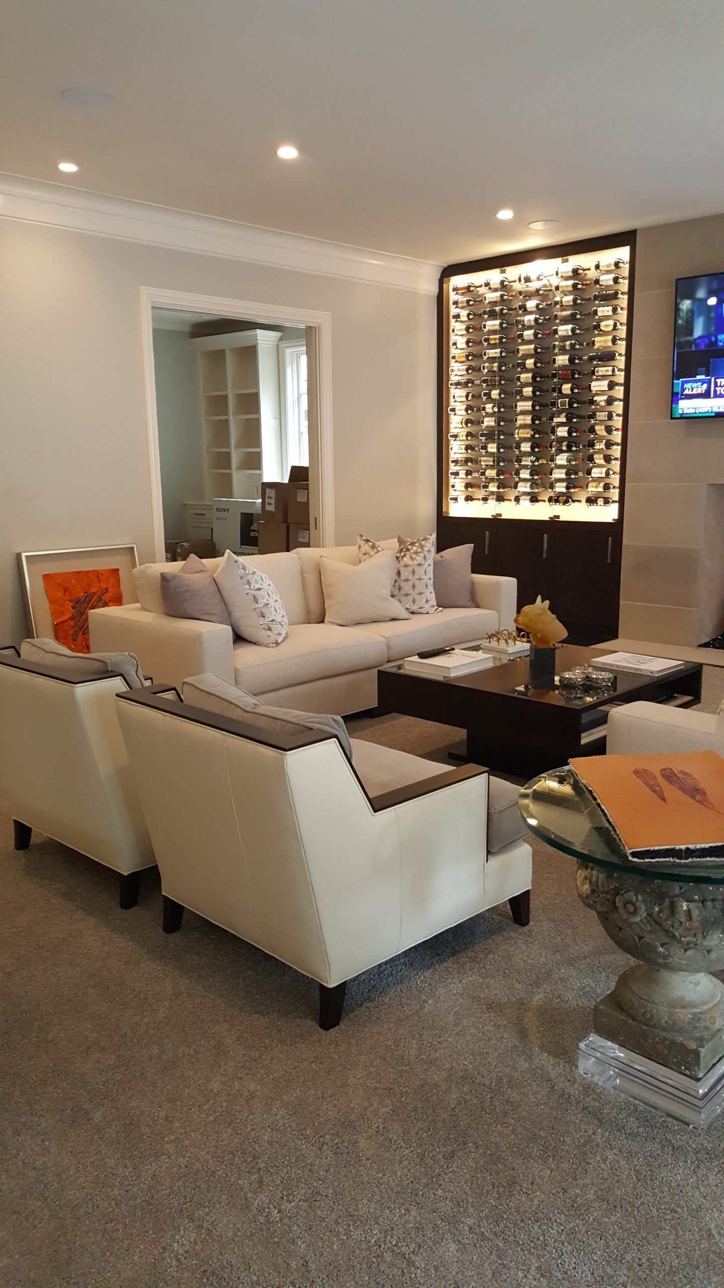 A living room filled with furniture and a television.