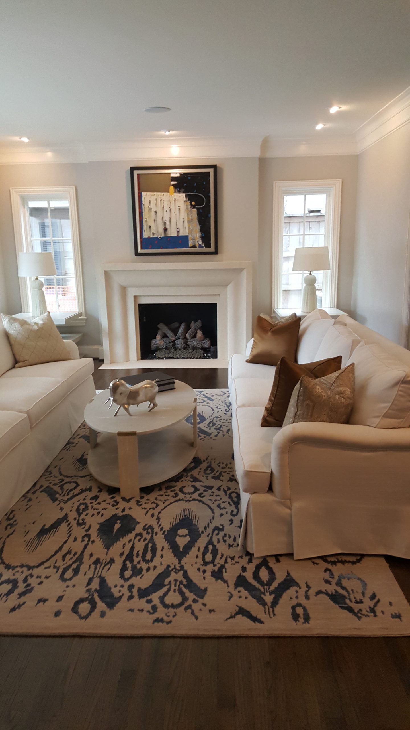 A living room filled with furniture and a fireplace.