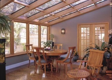 A room with a table and chairs in it