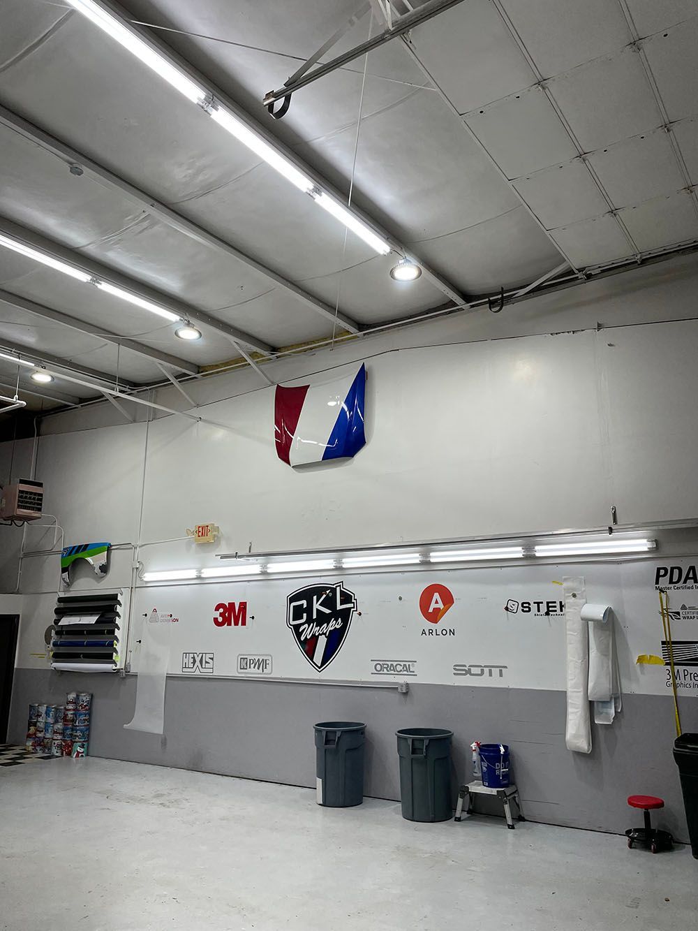 A large room with a lot of lights on the ceiling.