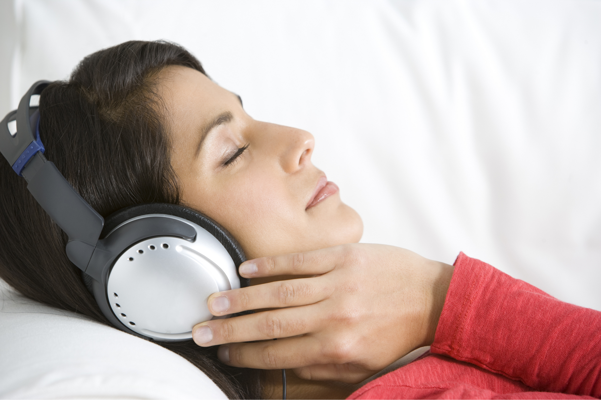 woman listening to healing frequencies during vibroacoustic therapy 