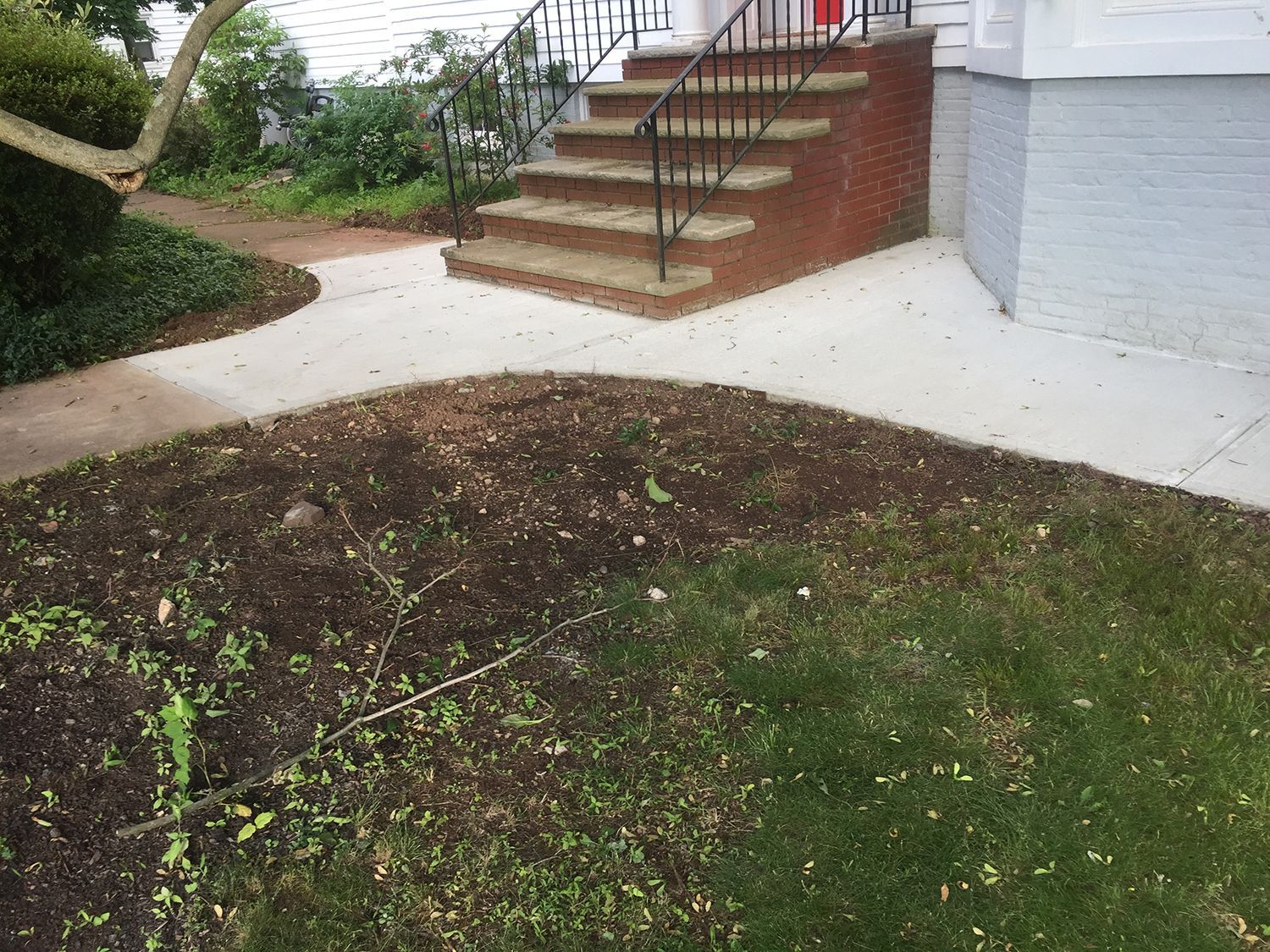 Concrete walkway and brick stairs
