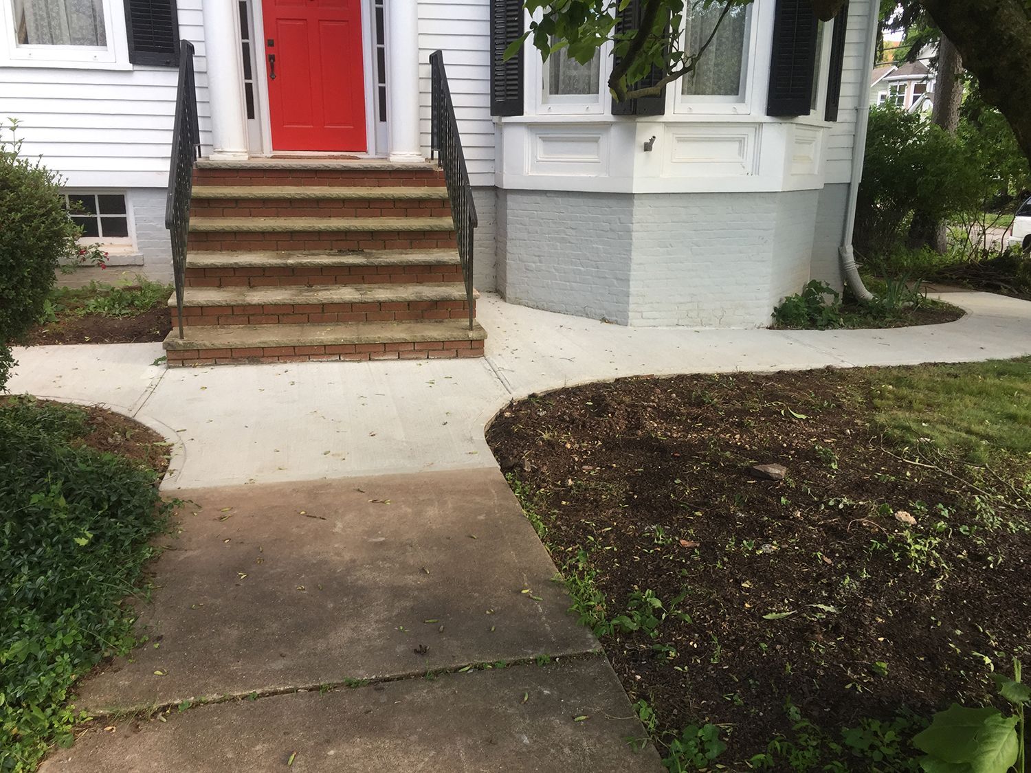 Concrete walkway and brick stairs