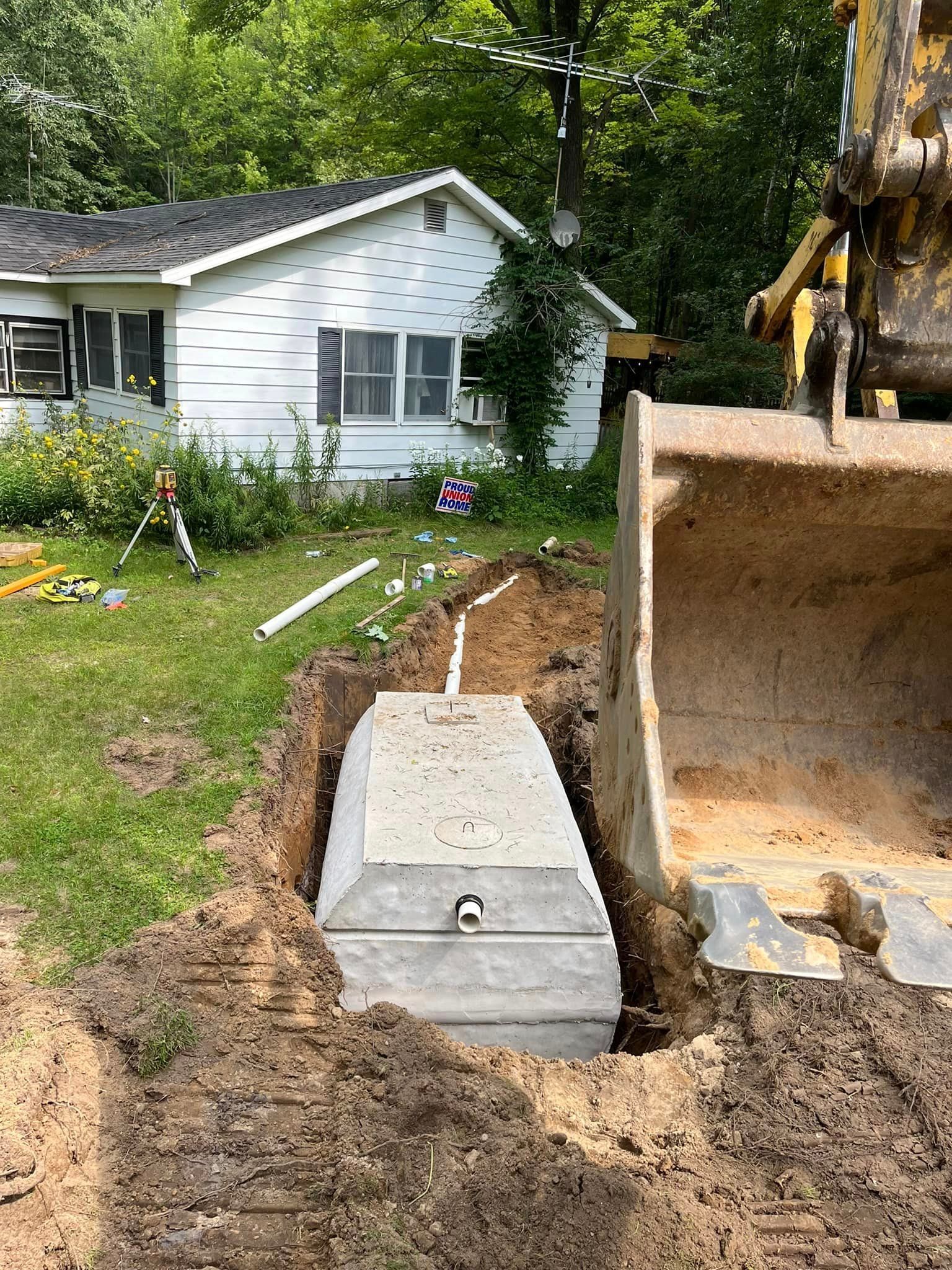 1000 Gallon Septic Tank being put in the ground 