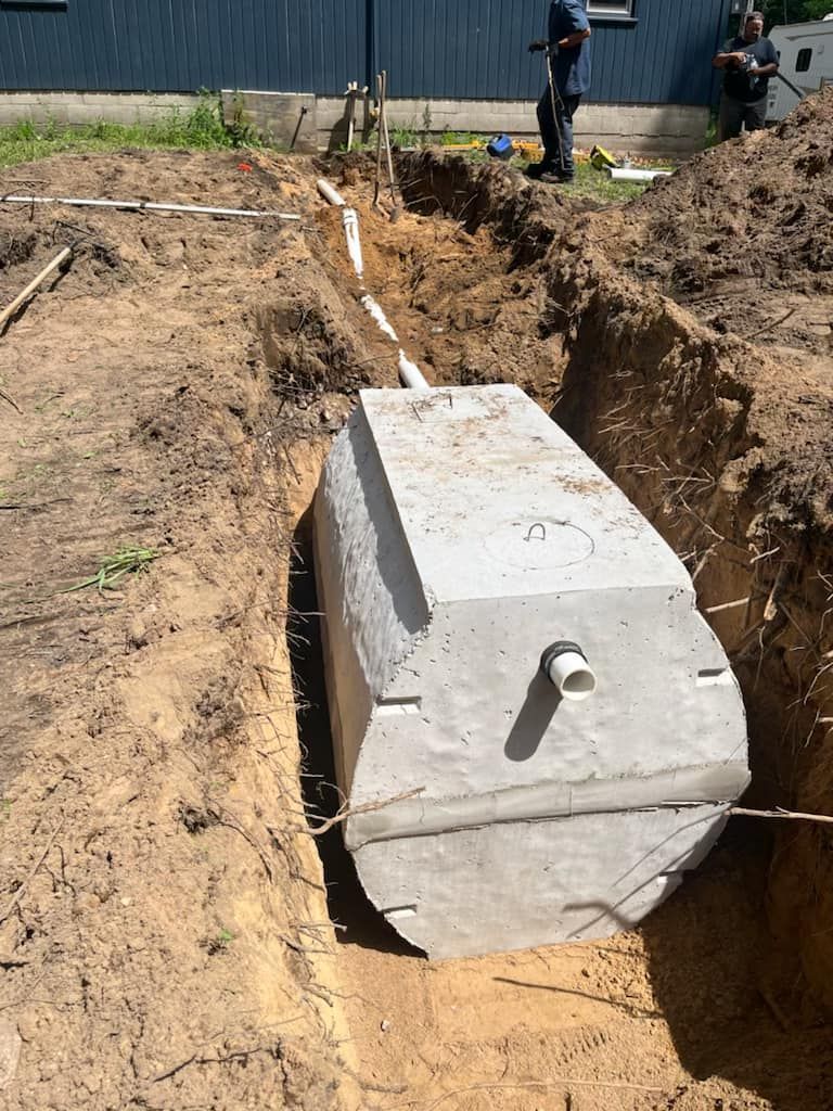 800 Gallon Septic Tank being put in the ground 