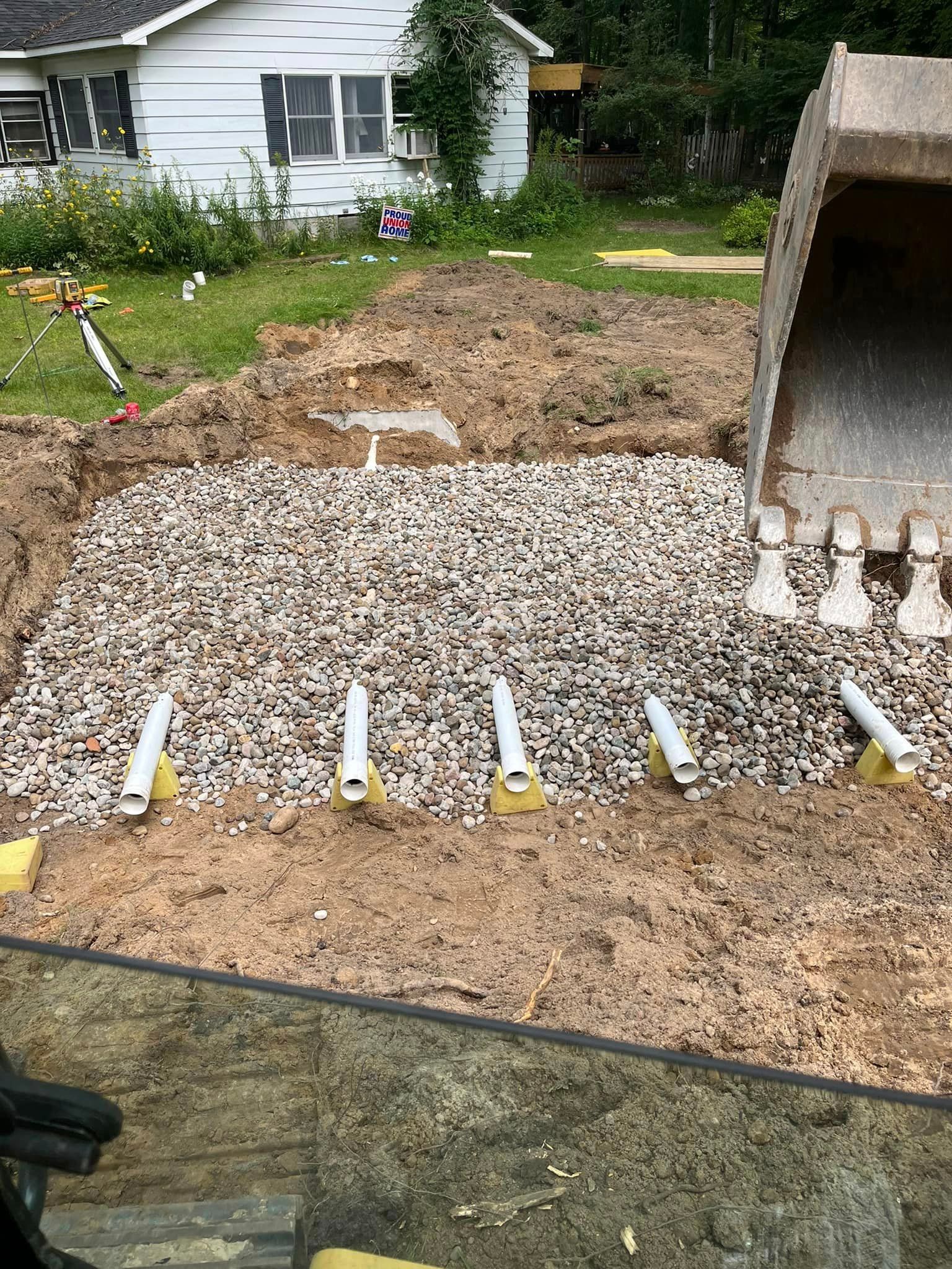 Septic Tank Being Covered with Rock 