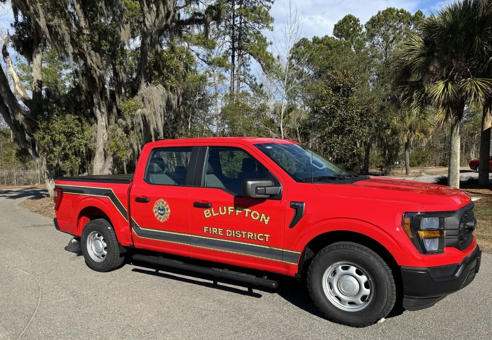 Red Ford F-150 truck, labeled 