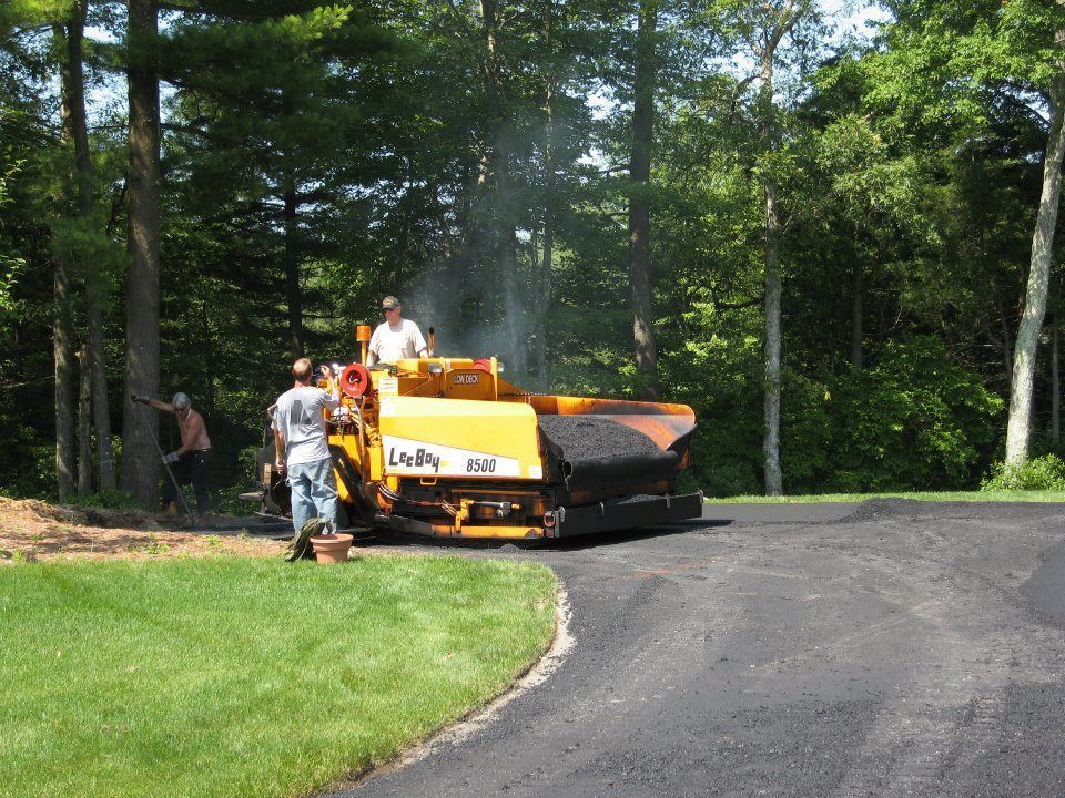 A man stands next to a machine that says lane on it