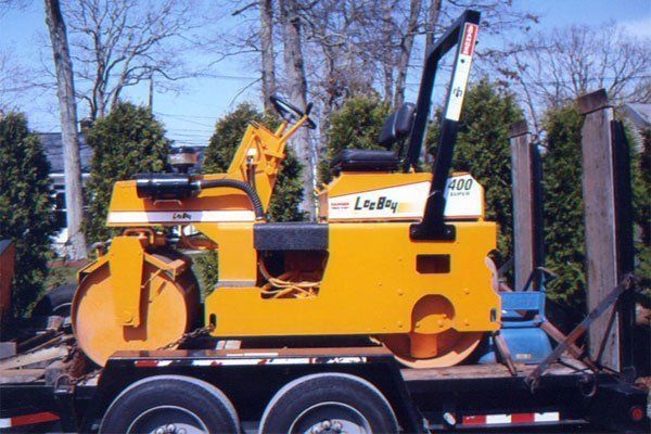 A yellow paving machine
