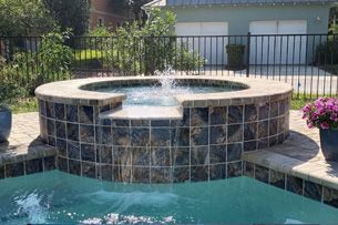 Learn More About Water Features A fountain in a pool