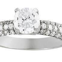 Diamond ring with a large center stone and a pavé band.