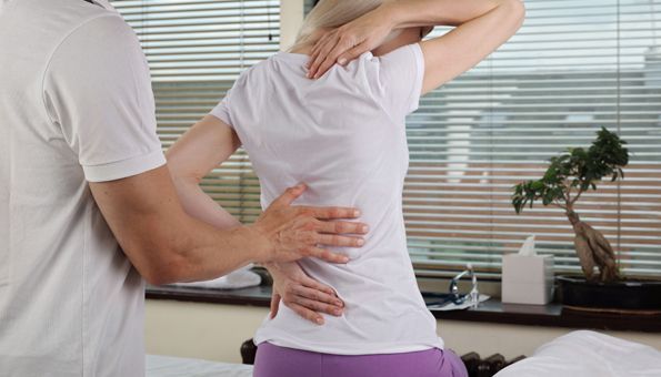 Patient with chiropractic appointment in a healthcare facility