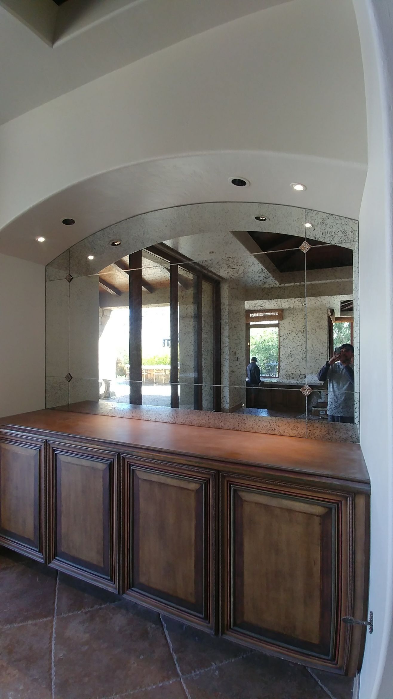 There is a large mirror in the middle of the room.