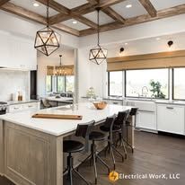 A kitchen with a large island in the middle of the room.