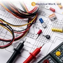 A bunch of electrical tools are laying on top of a drawing.