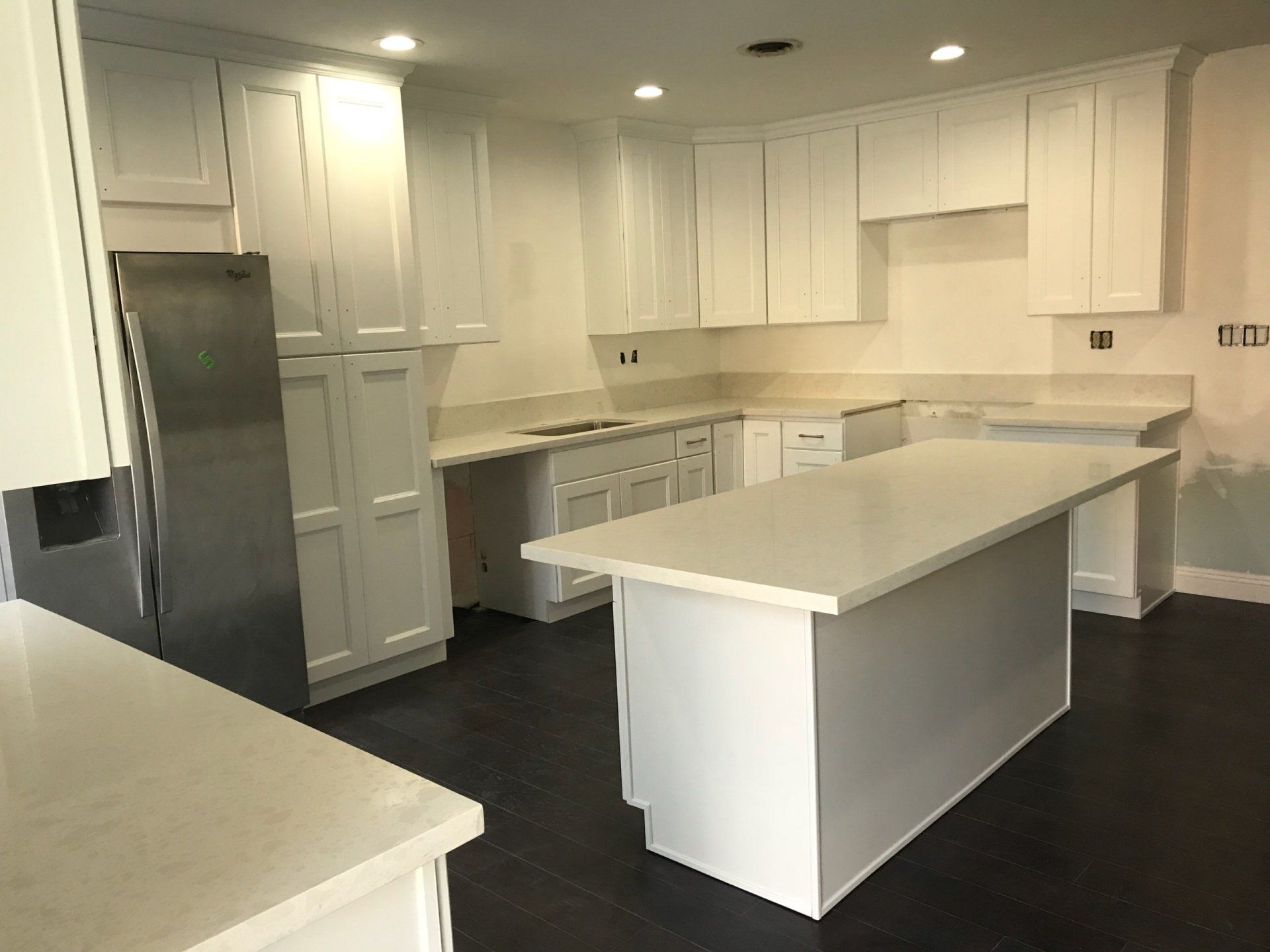 white kitchen cabinet and counter top