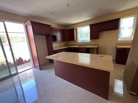 brown cabinets and beige counter top