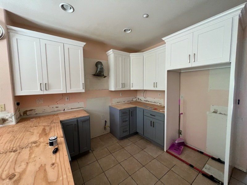 kitchen with white and gray cabinets