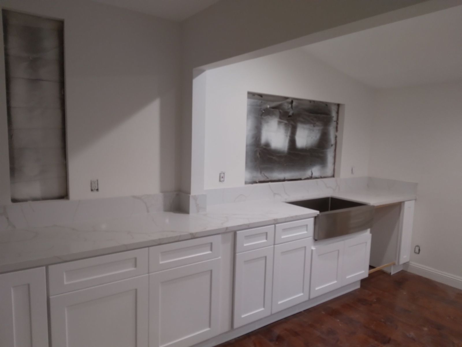kitchen with white cabinets and white marble counter top