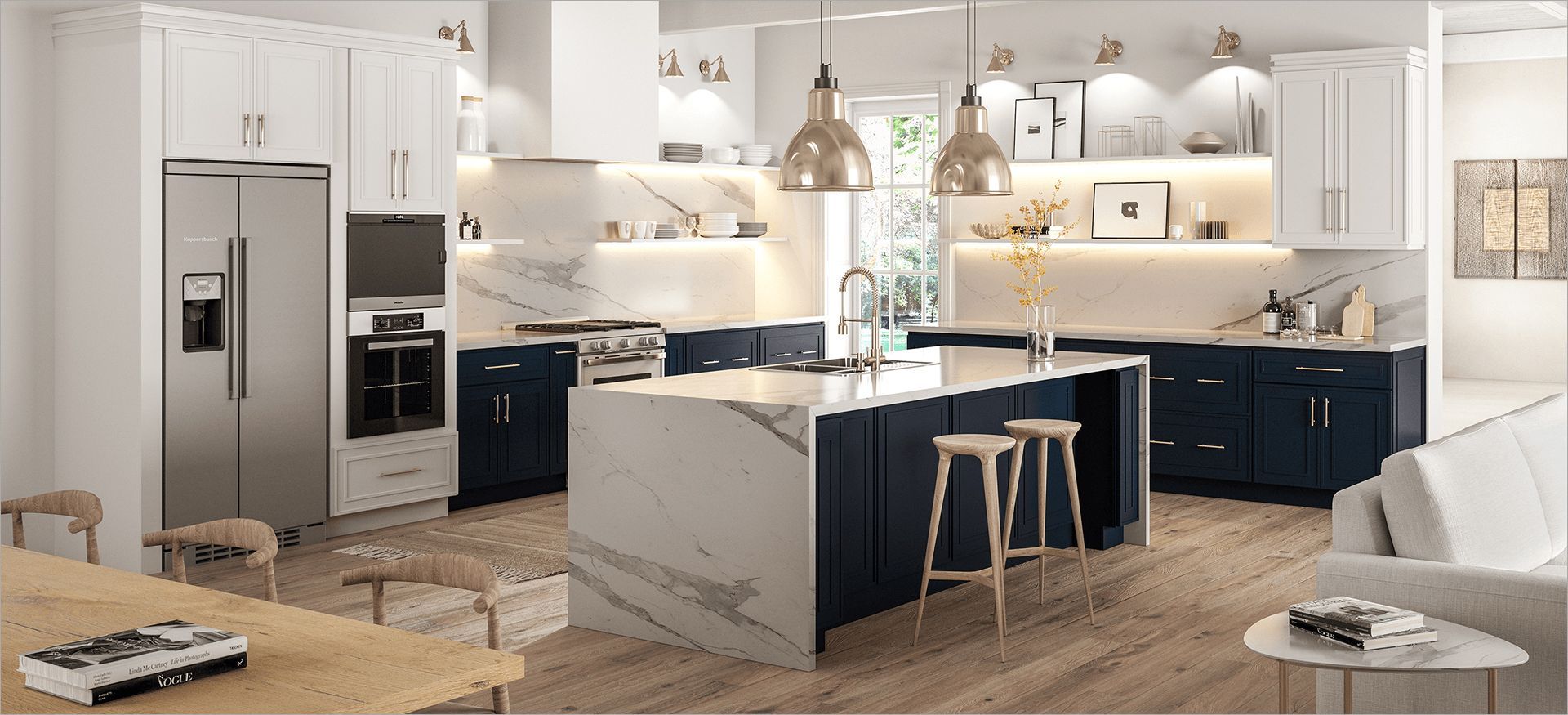 Modern kitchen with white and blue cabinets, marble countertops, and island with bar stools.