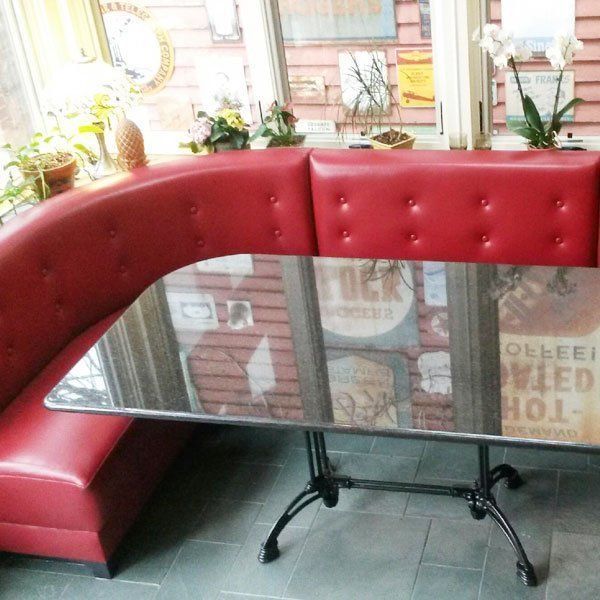 A glass table in front of a window with a sign that says rock