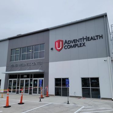 A large building with the word adventhealth complex on it