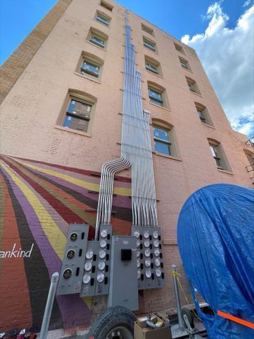 A large building with a lot of wires coming out of it.