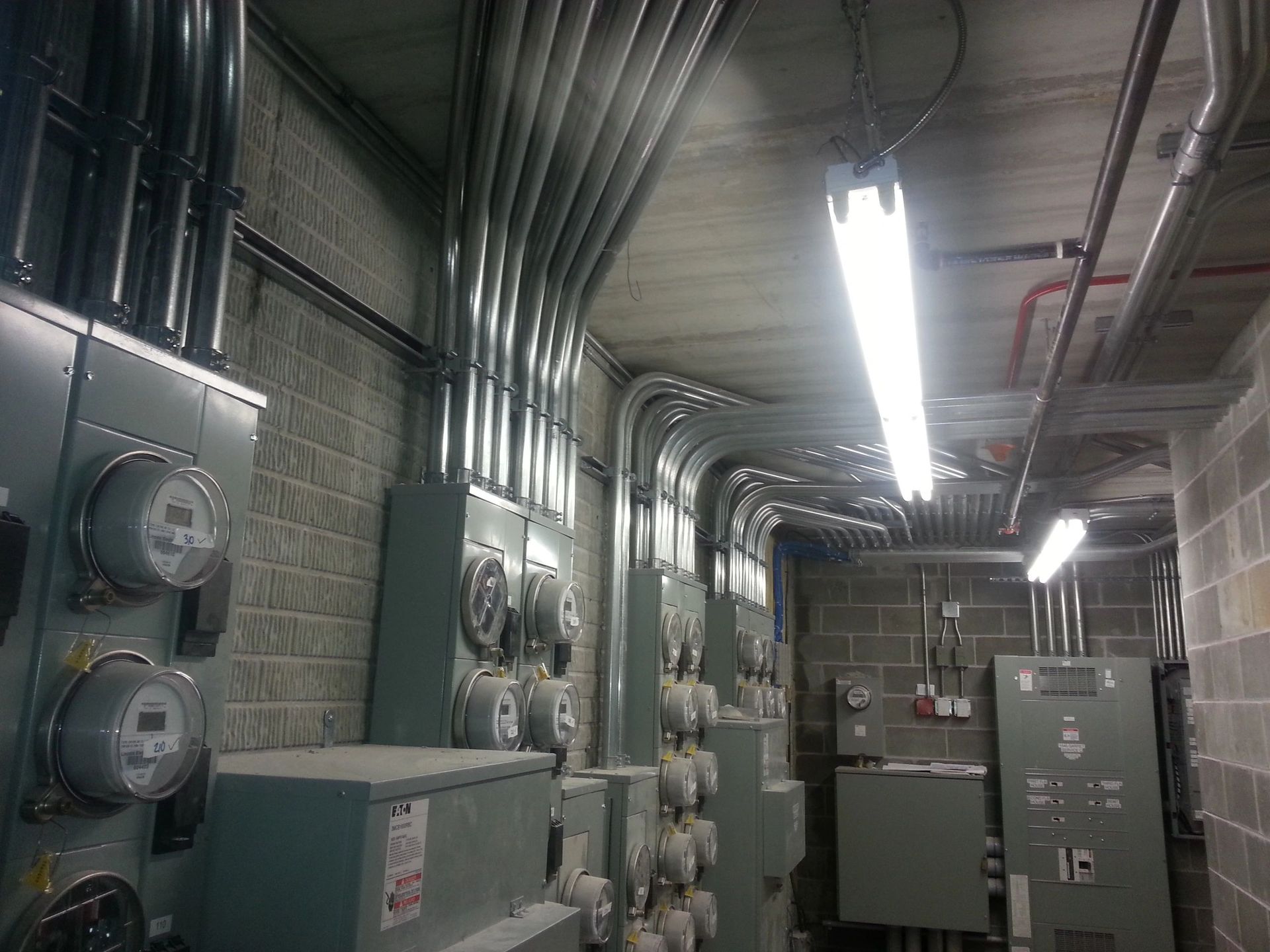 A room filled with lots of electrical equipment and boxes.