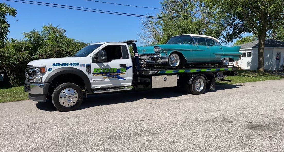 Teal car towing service