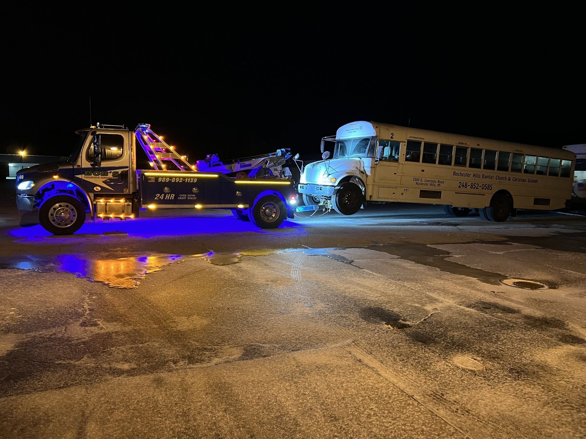 White bus towing