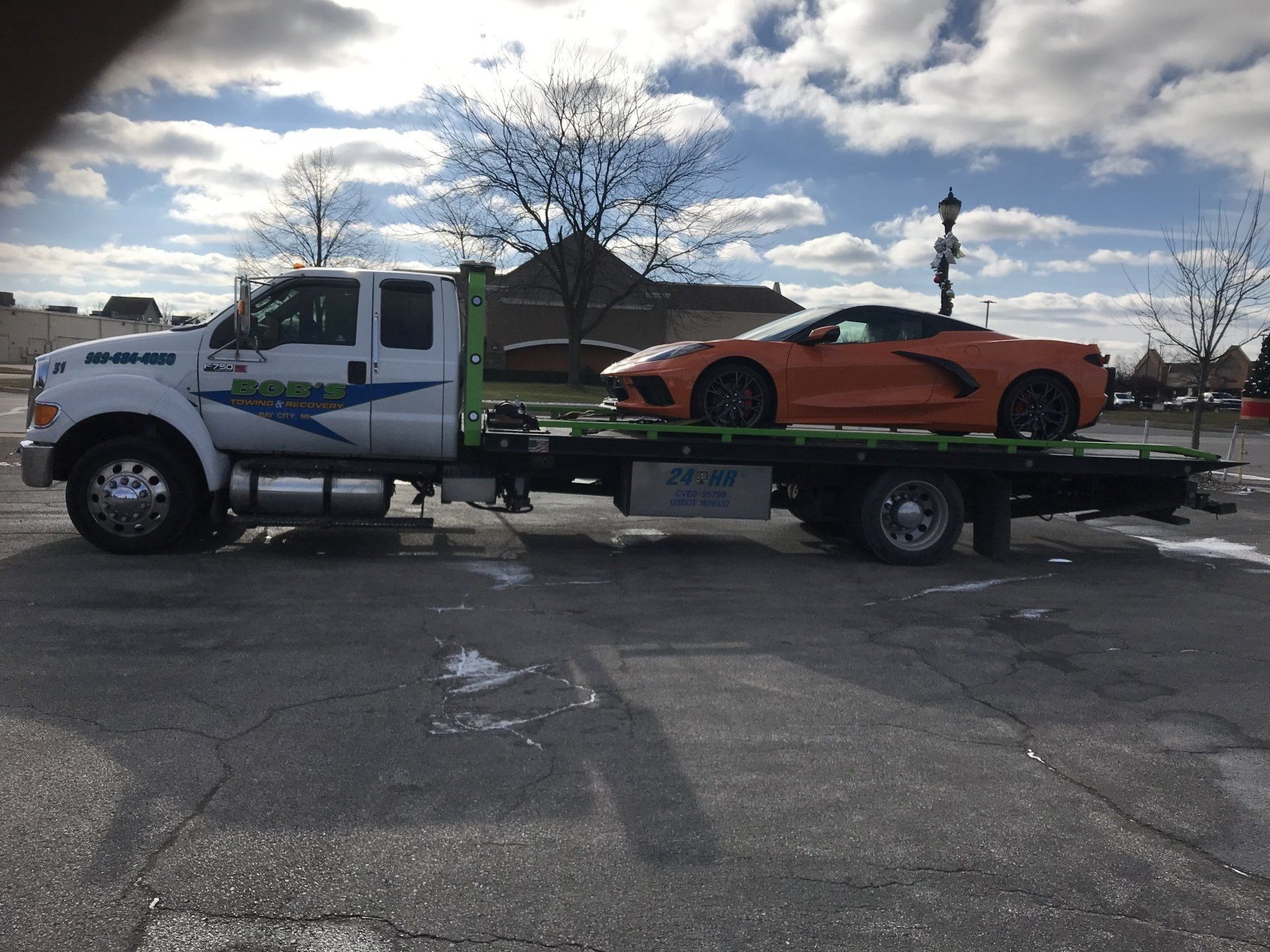 Orange car towing