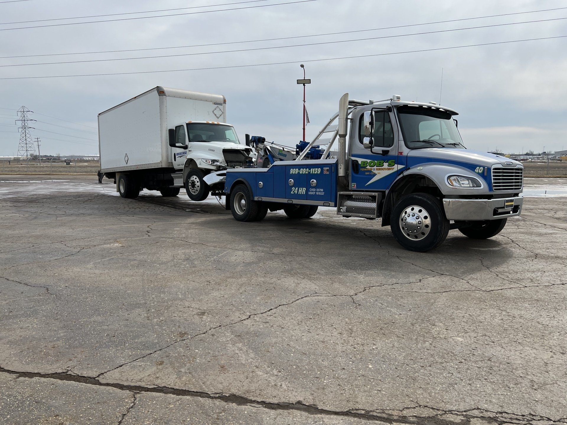 White truck being towed